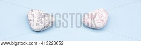 Sea Stones On A Blue Background, Vacation On The Sea Or Ocean
