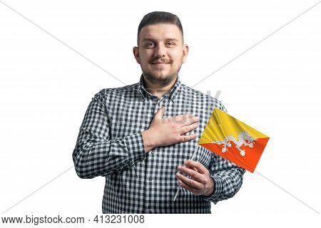 White Guy Holding A Flag Of Butane And Holds His Hand On His Heart Isolated On A White Background Wi