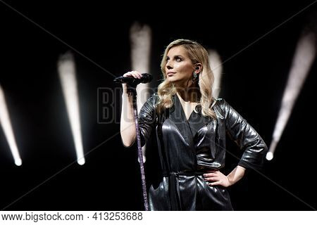 Young Beautiful Woman Singing In Whitel Smoke, Close Up.