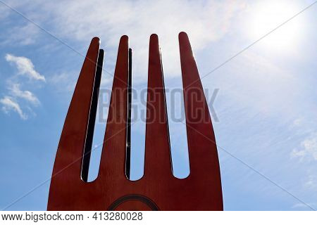 Fork Tines Close Up On Blue Sky Background