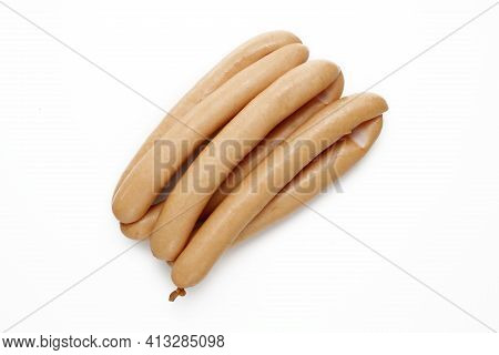 A Top View Of Wiener Sausages, Frankfurter, Hot Dog, Isolated On A White Background. Sausage In Ring