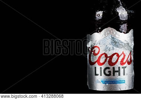 Sandhurst, United Kingdom, 18th March 2021:- A Bottles Of Coors Light Isoalted On A Black Background