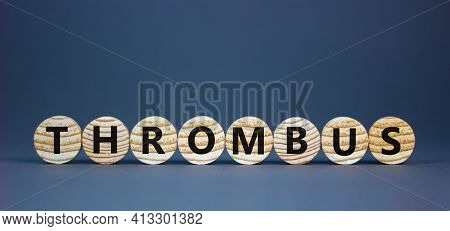Medical And And Thrombus Symbol. Wooden Circles With The Word 'thrombus'. Beautiful Grey Background.