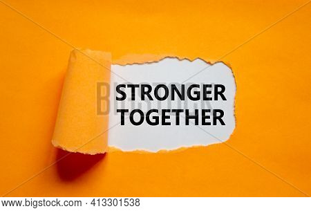 Stronger Together Symbol. Words Stronger Together Appearing Behind Torn Orange Paper. Business, Moti