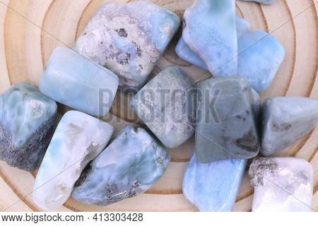 Larimar Heap Jewel On Wood Saw Circles Texture. Pile Mineral Pebbles Background.