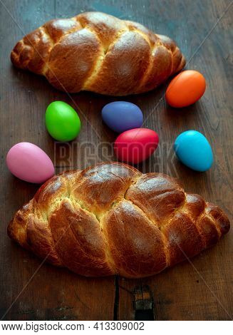 Easter Eggs And Tsoureki Braid, Greek Easter Sweet Bread, On Wooden Background