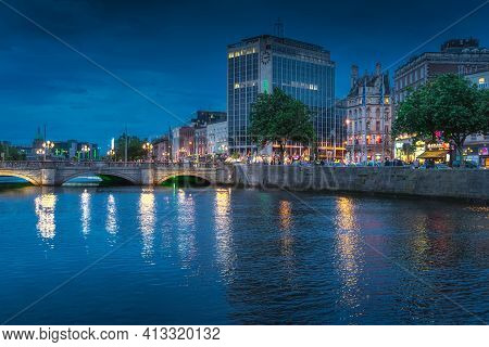 Dublin, Ireland, August 2019 Dublin nightlife. Night photography of OConnell street and bridge, tall Heineken building illuminated by city lights