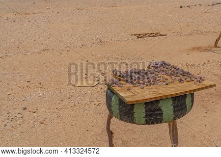 Typical Roadside Scene Where You Can Stop And Buy Stone Souvenirs At Dorob National Park In Namibia.