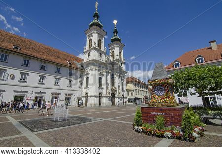 Graz,austria-july 07, 2020: The Famous Clock Tower, One Of The City Main Attractions, Made Of Flower