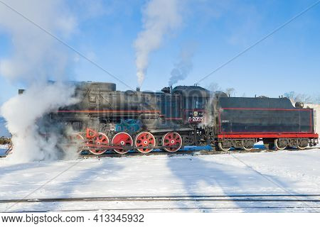 Sortavala, Russia - March 10, 2021: Side View Of A Soviet Mainline Freight Steam Locomotive 