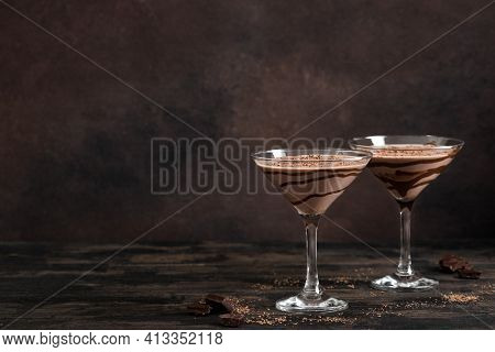 Chocolate Truffle Martini Cocktail On Dark Wooden Background, Copy Space. Mudslide Truffletini Cockt