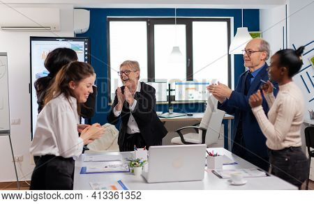 Happy Diverse Colleagues With New Business Opportunity Enjoing Victory. Multiethnical Partners Cowor