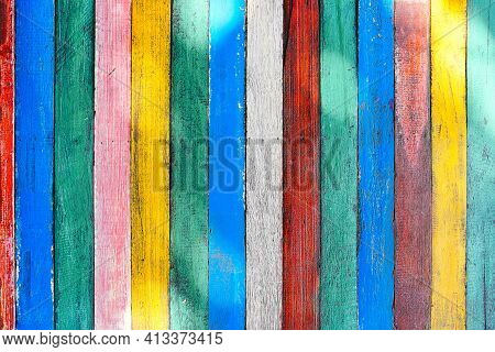 Mulricolored Wooden Table Board Surface Background Or Wallpaper. Thin Colorful Vertical Rough Boards