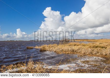 Waves And Foam During Stormy Weather On The Lake In Roegwold, Netherlands