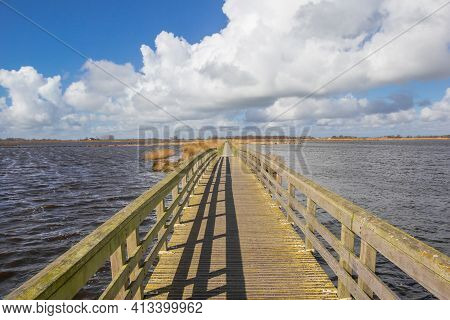 Wooden Bridge Over The Lakes In Roegwold Nature Reserve In Groningen, Netherlands