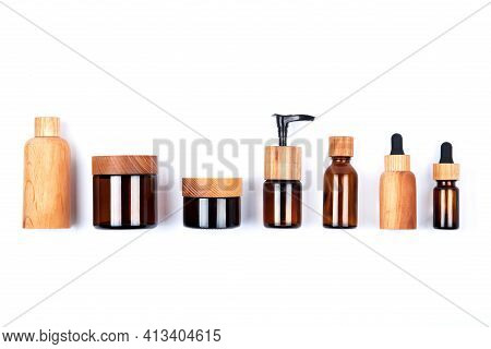 Top View Of Different Sizes Wooden And Glass Bottles Containers Blank Mockup For Skincare Beauty Cos