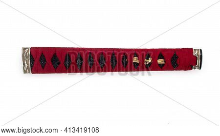 Handle Of Samurai Katana Japanese Sword. Handmade Tsuka With Red Wicker Ornament Isolated On A White