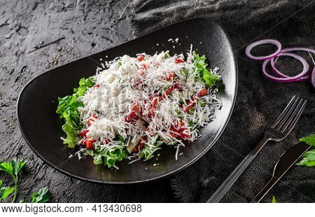 Gourmet Appetizing Vegetable Salad With Cheese, Salad Leaves And Parsley. Shopsky Salad In A Bowl Ov