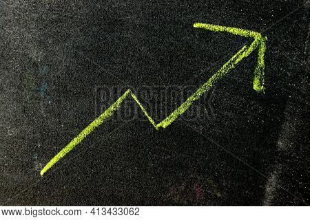 Green Color Chalk Handdrawing As Upward Arrow Graph On Blackboard Or Chalkboard Background (concept 