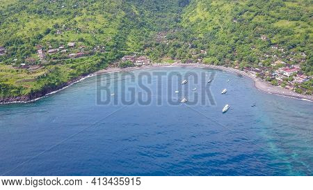 Aerial Drone View From The Sea To The Jemeluk Bay. Amed Is Fast Becoming A Popular Tourist Destinati