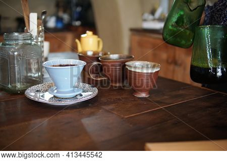 Barista Preparing Brewing Coffee With Coffee Maker And Drip Kettle.