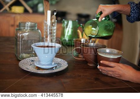 Barista Preparing Brewing Coffee With Coffee Maker And Drip Kettle.