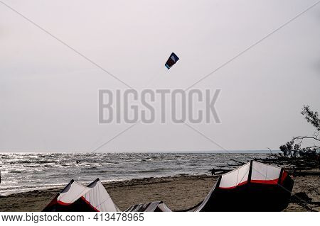 A Young Man Is Engaged In Extreme Kiteboarding In The Gulf Of Riga On October 21, 2020 At Cape Kolka