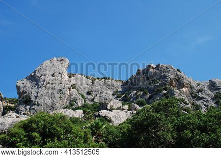 The rocky peaks of the Tramuntana mountains in the Boquer valley trail near Puerto Pollensa on the Spanish island of Majorca.