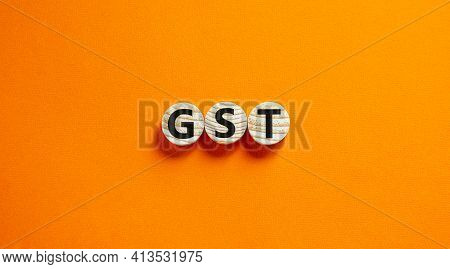 Gst, Goods And Services Tax Symbol. Concept Words Gst, Goods And Services Tax On Wooden Circles On A