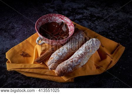 Fartons, Typical Pastries From Valencia, Spain, With Hot Chocolate, In A Chinese Ceramic Container O