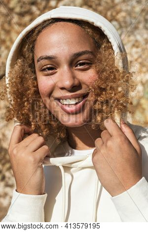 Beautiful woman in white hoodie winter fashion