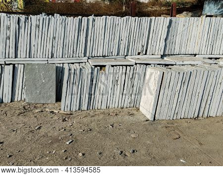 Stock Photo Of Large Number Of Grey Kota Stone Piled Up On Another For Sale In Bright Sunlight At Gu