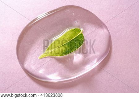 A Drop Of Transparent Cosmetic Gel On A Pink Background
