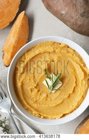 Mashed Cooked Sweet Potato, Batata Potatoes Puree In Bowl With Butter And Herbs.