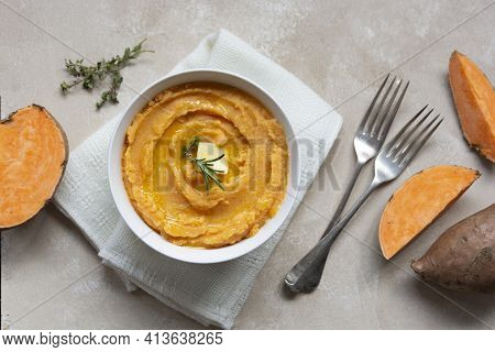 Mashed Cooked Sweet Potato, Batata Potatoes Puree In Bowl With Butter And Herbs.