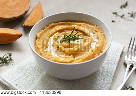 Mashed Cooked Sweet Potato, Batata Potatoes Puree In Bowl With Butter And Herbs. Thanksgiving Dinner