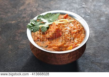 Chicken Kadhai, Curry, An Oriental Dish, On A Black Stony Background. Traditional Indian Cuisine. Sa