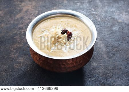 Korma, An Oriental Dish On Black Stony Background. Traditional Indian Cuisine. Curry Dish, Sweet Sau