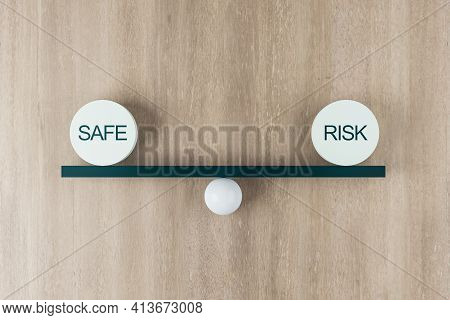 Risk Assessment And Business Opportunity Concept With Equal Weight Plates With Safe And Risk Words O