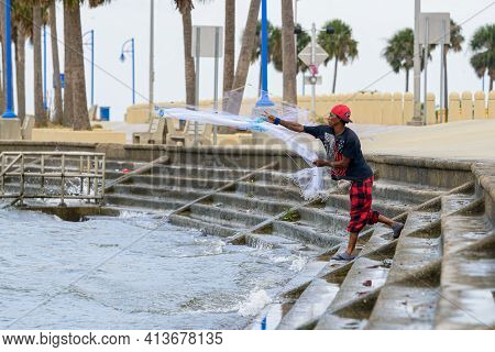 New Orleans, La - October 9: Man Casts Net For Bait On Lake Pontchartrain On October 9, 2020 In New 