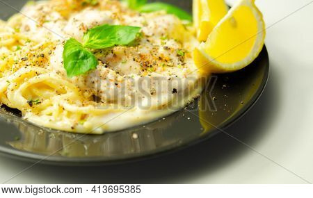 Carbonara, Spaghetti With A Cheese And Smoked Bacon Sauce Topped With Chicken Breast Pieces And Rega