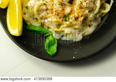 Carbonara, Spaghetti With A Cheese And Smoked Bacon Sauce Topped With Chicken Breast Pieces And Rega