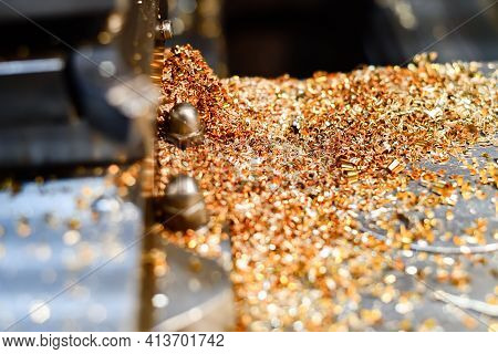 Brass And Bronze Shavings On A Lathe After Processing Non-ferrous Metals.