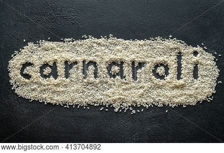 Uncooked Carnaroli Rice On The Wooden Background