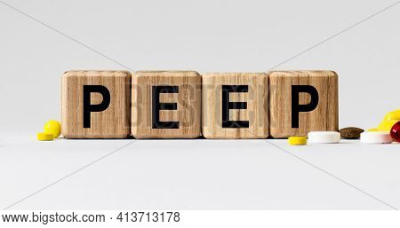 Cubes With The Word Peep On Them. Care Concept
