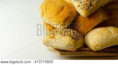 Various Types Of Bread Served On A Wicker Tray, Delicious And Fresh Rolls