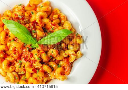 Cooked Cellentani Pasta With Cooked Chicken Breast And Peppers In A Spicy Tomato And Jalapeno Dressi