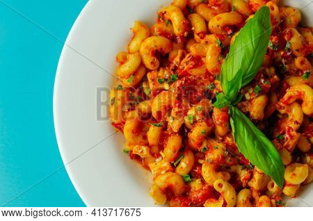 Cooked Cellentani Pasta With Cooked Chicken Breast And Peppers In A Spicy Tomato And Jalapeno Dressi