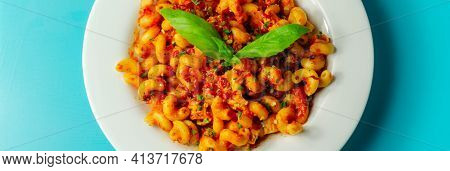 Cooked Cellentani Pasta With Cooked Chicken Breast And Peppers In A Spicy Tomato And Jalapeno Dressi