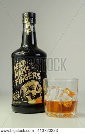London, United Kingdom - August 04, 2020 A Glass With Spiced Rum Called Dead Man's Fingers And Ice C